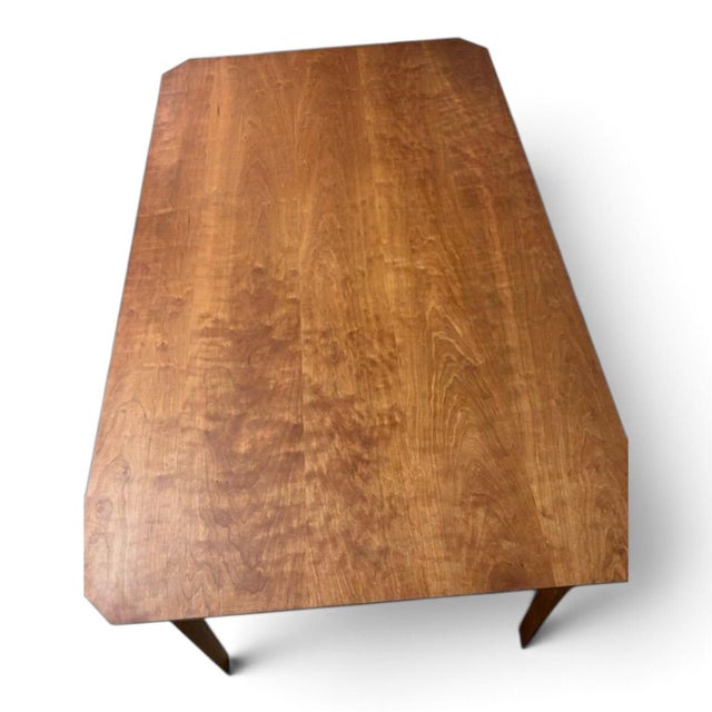 This fine solid cherry wood dining table is an antique piece that exudes elegance and charm. Made from high-quality solid...