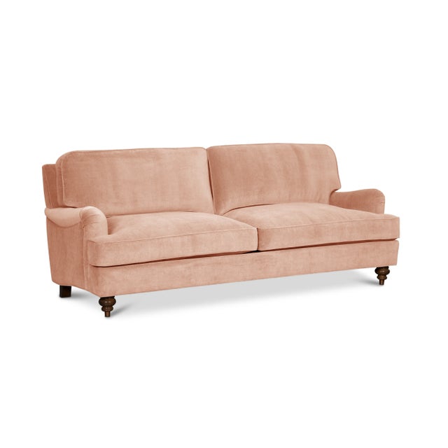 Timeless style meets luxurious comfort in this high-end English Roll Arm sofa. Upholstered in 100% cotton velvet with a...