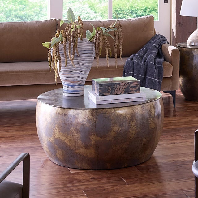 A luminous mix of antique brass and silver tones gives this handcrafted coffee table its distinctive warmth and modern...