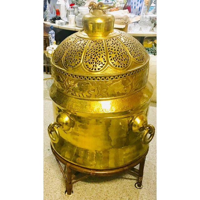 Amazing massive brass chandelier and planter on wheels can be used as a side or cocktail table. The bottom has 4 massive...