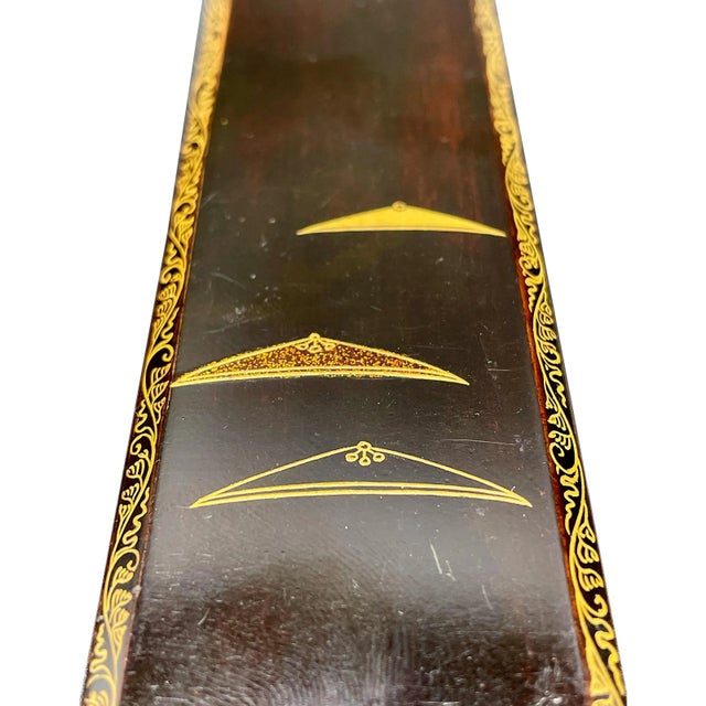 Slender lacquered storage box from the late Edo period. Black lacquer with applied designs in labor-intensive maki-e and...