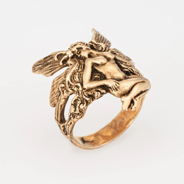 Stylish and finely detailed fairy ring crafted in 14 karat yellow gold. The ethereal ring depicts a winged fairy in...