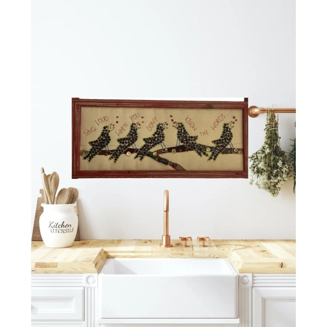 A large, signed folk art textile by Mary Teeter, dated 2005. “Sing Loud When You Don’t Know the Words” features a row of...