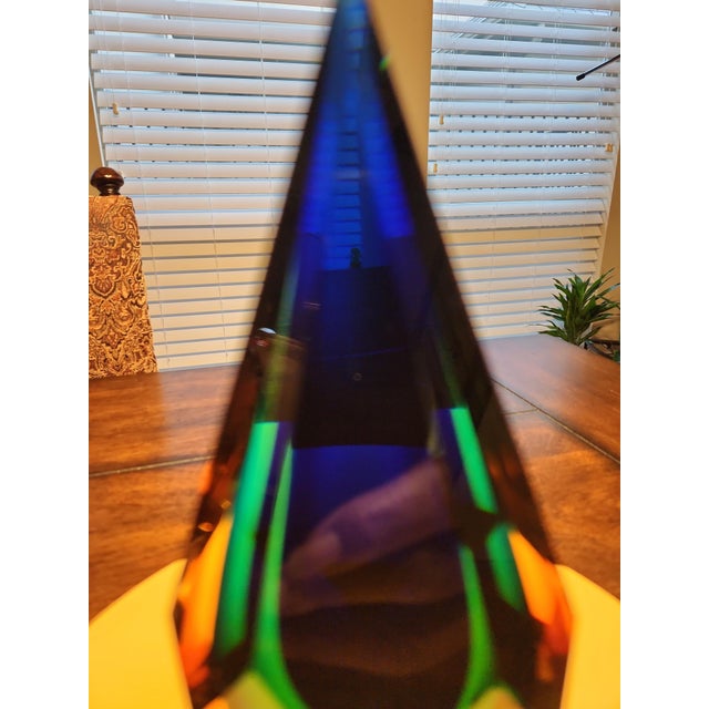 This is a magnificent example of mid-century Italian art glass artistry. This striking 7-inch faceted teardrop obelisk...