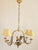 Elegant French Country style tole gilted and painted Italian rooster motif chandelier. The chandelier features a perch...