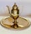 A gold tinted bronze alloy coffee pot in the Hollywood Regency style. The pot has a classical urn shaped body, a thin...