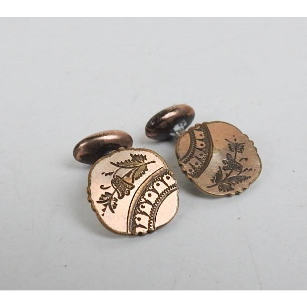Antique late 19th century gold filled cufflinks with Aesthetic Movement engraved design. Overall surface wear.