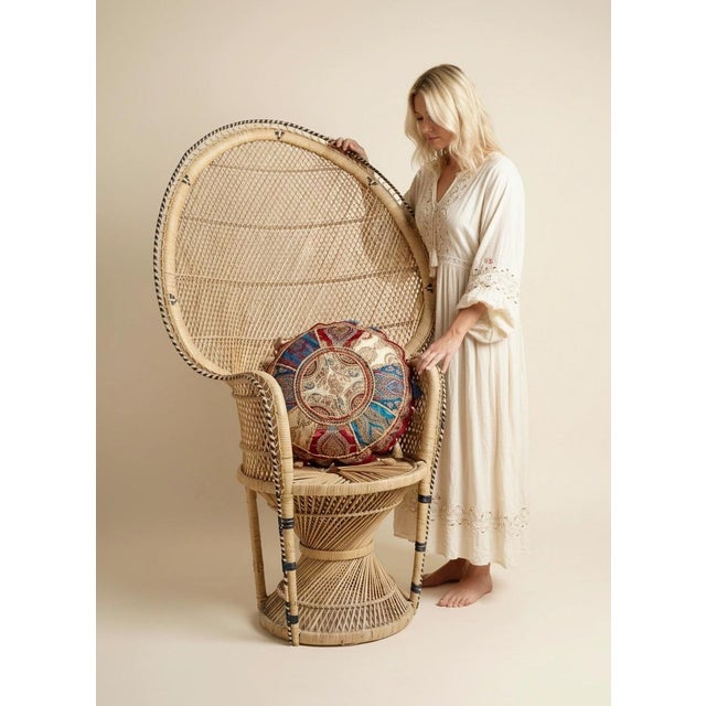 A striking philippine peacock chair dating from the 1950s, entirely handwoven in natural rattan and designed in the iconic...