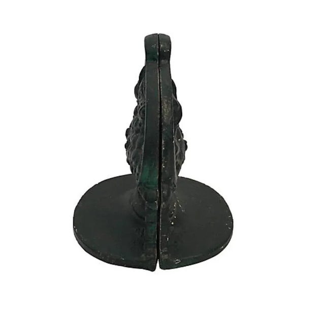 Pair of painted cast iron flower basket bookends. Signed "W." Wear co sister with age and use, paint chips.