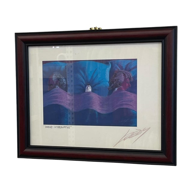 Framed print titled "Dogus Interruptus" by American artist Jeff Leedy. The artwork features Leedy's signature surreal and...