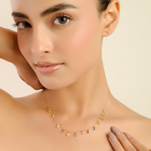 This classic fringe necklace featuring 15 pear cut multi sapphires totaling 4.45 carat, set in rich 18k yellow gold. Each...