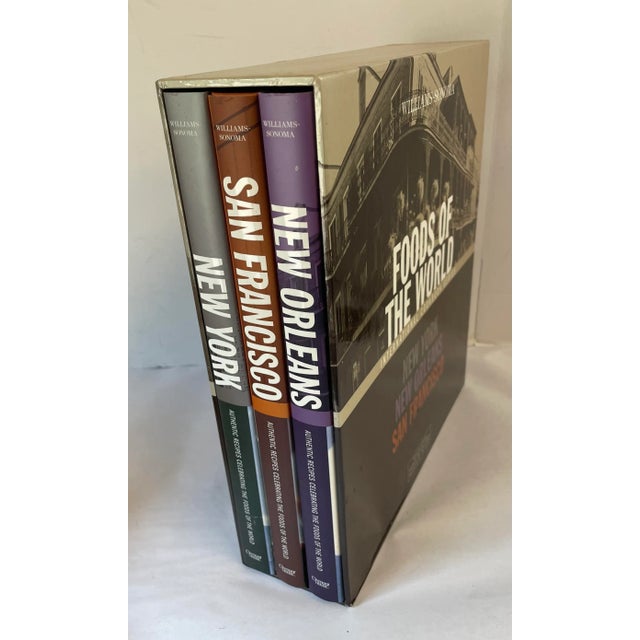 Boxes set of three foods of the world cookbooks from William Sonoma. Included are San Francisco, New Orleans and New York....