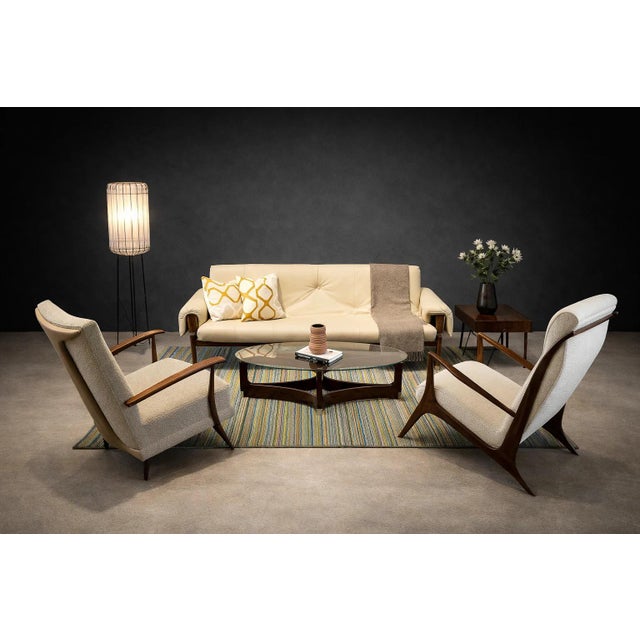 Designed in the 1950s, this armchair reflects the disciplined modernist sensibility associated with John Graz, a Swiss-...
