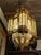 Monumental Arab-Moorish Hanging Lantern in Pierced Metal with Translucent Panels, circa 1920–1940 A striking and highly...