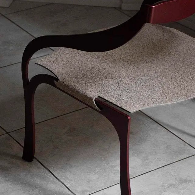 A single story of metal that becomes warm and soft. the break armchair by wm is inspired by the soft classic lines. an...