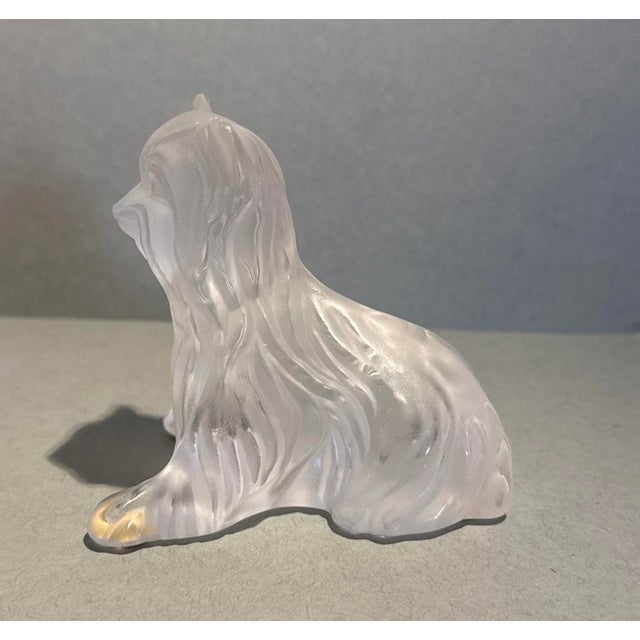 Add a touch of classic French elegance to your collection with this exquisite Lalique frosted crystal Yorkshire Terrier...