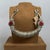 A traditional piece of jewelry with a tribal allure and extraordinary visual impact. This rare and massive nomadic torchon...