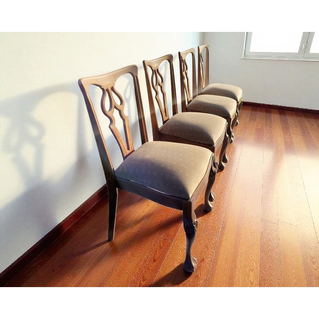 Set of Four Chippendale Style Oak Dining Chairs, 20th Century Elegant set of four Chippendale-style dining chairs crafted...