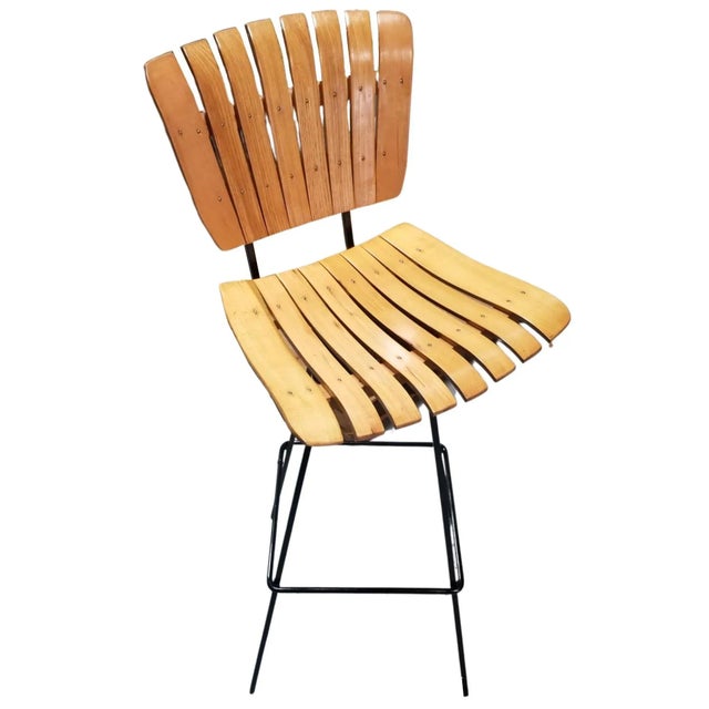 Restored Arthur Umanoff four slat bar stools in Oak with rod iron legs and swivel seats. Arthur Umanoff (1923-1985) was a...