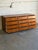 This lowboy presents a sleek profile with twelve flush storage compartments. Clean horizontal lines are supported by a...