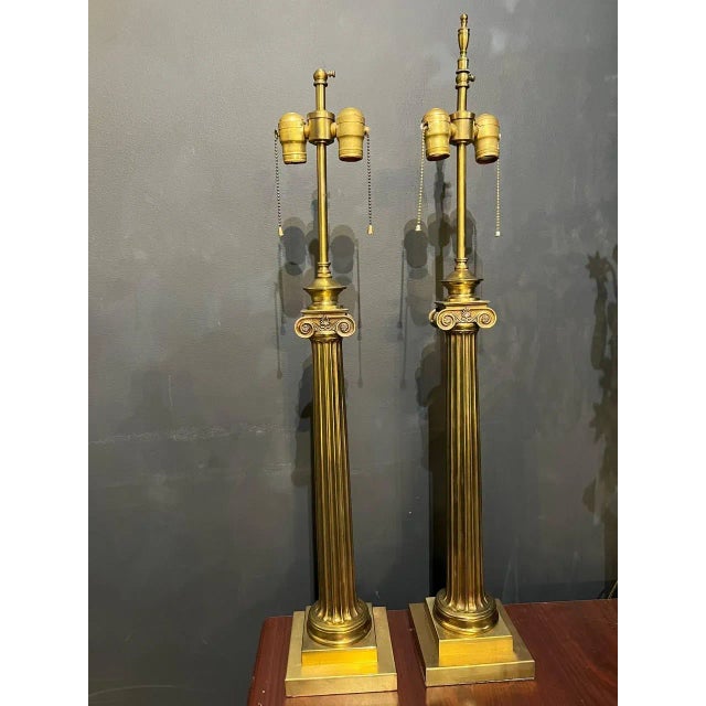 A circa 1930's neoclassic column shape bronze table lamps. In very good condition.