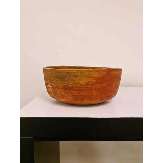 An antique and unique organic wooden bowl. With highly appealing patina, faded painting on the bowl makes this a unique...