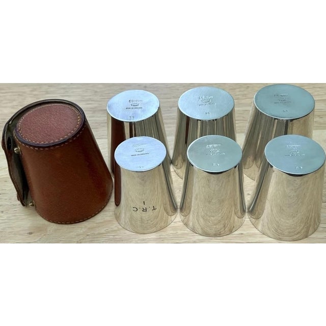 Size: Largest cup is 2 1/2H x 2 1/8 diameter Weight: 354 grams Each shot cup bearing the makers name & numbered 1 to 6...