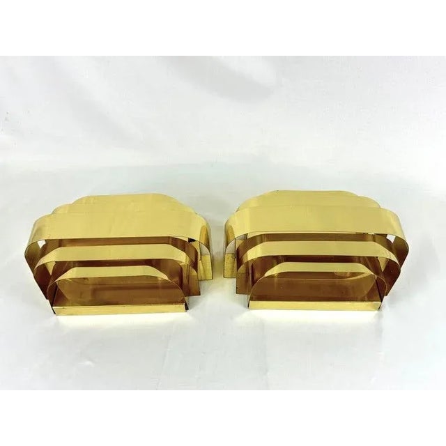 Pair of Curtis Jere Style Brass Wall Sconces by Lightolier. Cloud like shape with 5 ribbon front strips of brass for the...