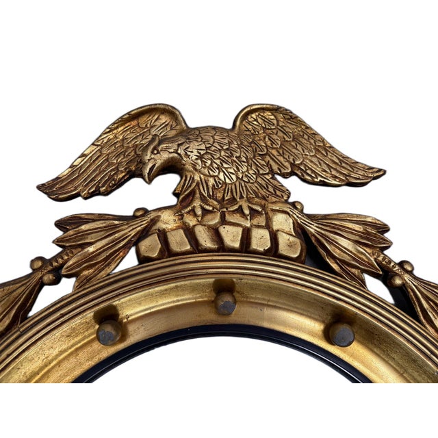 Early 19th Century American Federal Giltwood Convex Bullseye Eagle Mirror A striking, highly collectible example of early...