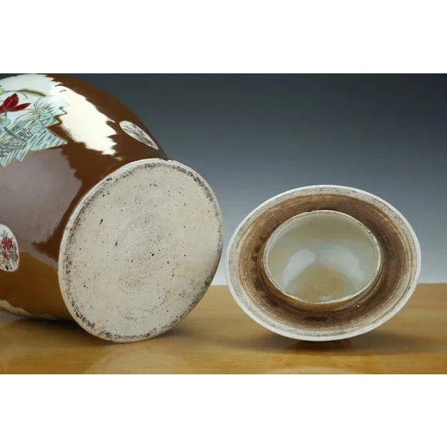 A large Chinese porcelain baluster shaped jar with original cover. Decorated with three tobacco leaf panels featuring...