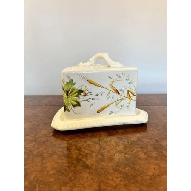 Large antique Victorian cheese dish having a shaped handle with leaf decoration to the top with ribbed and floral...