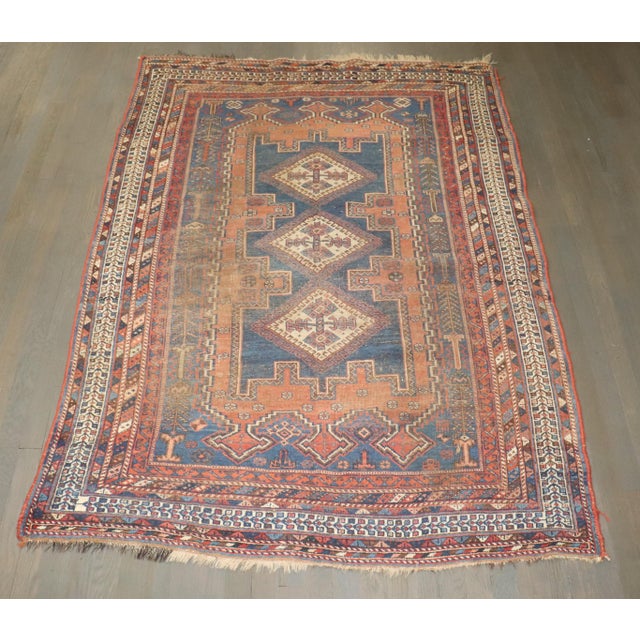 An early 20th-century Worn Persian Shiraz Tribal Rug Details rug no. j4292 size 4' 5" x 6' 4" (135 x 193 cm)