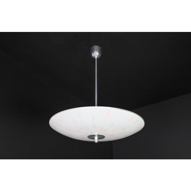 This pendant lamp is a magnificent piece of mid-century graphics and design that was showcased at the czechoslovakia...