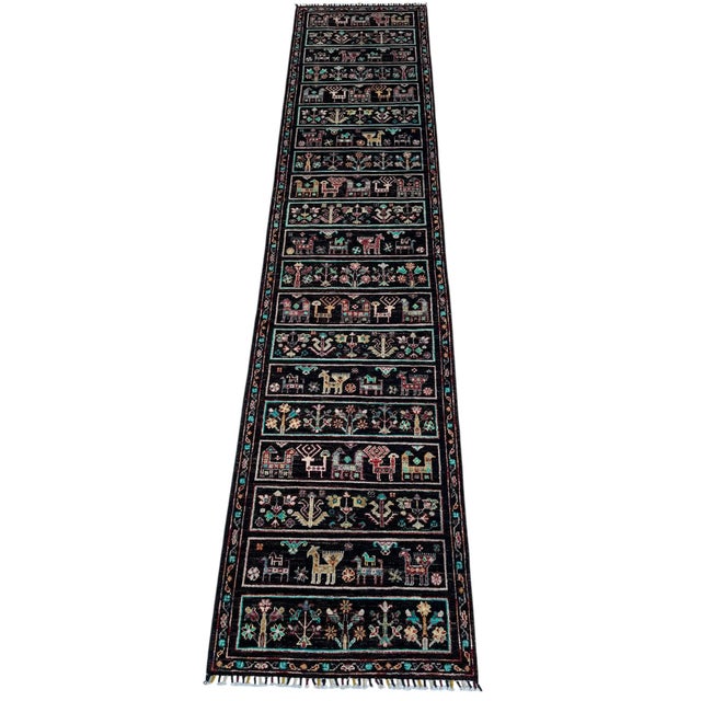 A long runner in the Bakhtiari kheshti garden-panel design, hand-knotted in northern Afghanistan from hand-spun Ghazni...