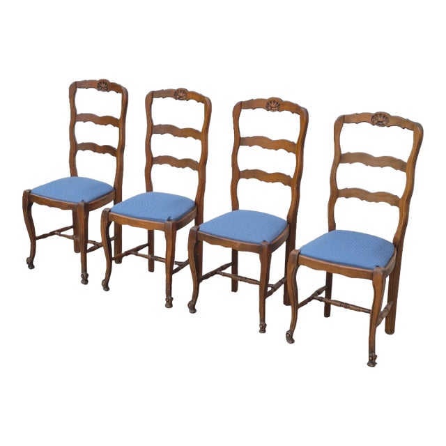 Early 20th Century French Country Shell Carved Walnut Ladder Back Dining Chairs W/ Upholstered Sprung Seats, Set of 4 For Sale