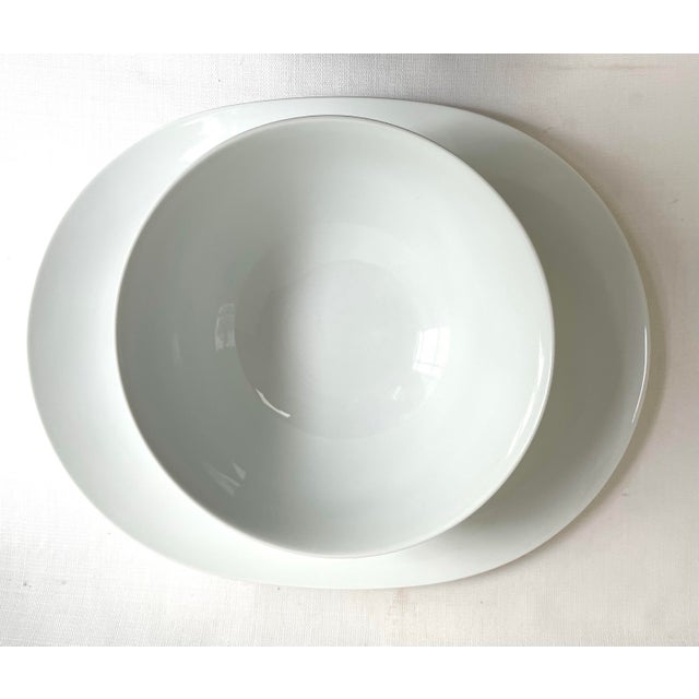 This serving set by Studio Nova features clean modern lines. In their Tivoli White pattern these pieces would blend...