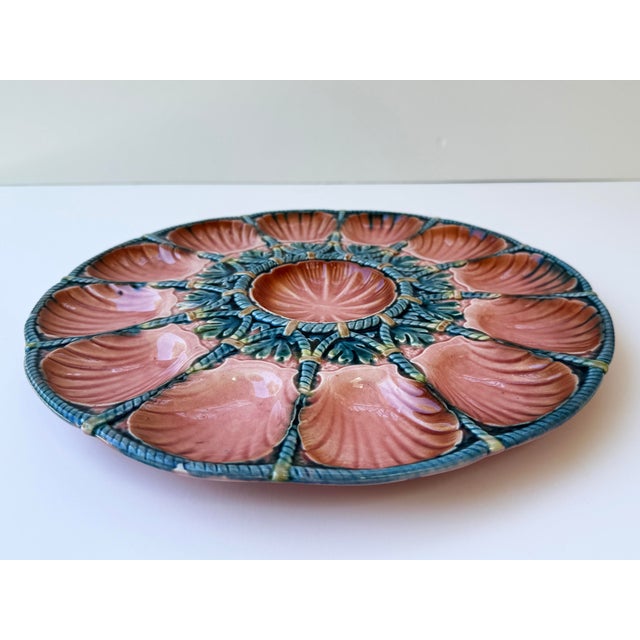 A stunning and highly decorative French Majolica oyster platter by Sarreguemines, dating to approximately 1920....