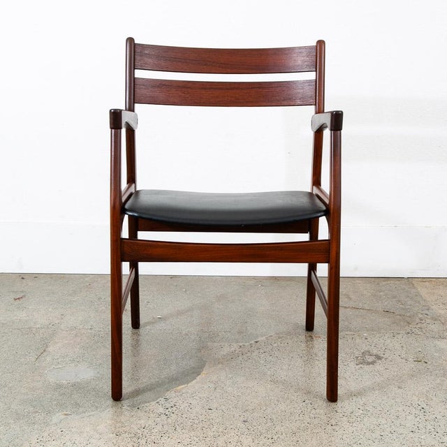 Outstanding captains dining chair / armchair in solid teak. Comes in an black vinyl. Recently Imported directly from...