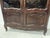 Small Regency-style display cabinet in solid oak Two glass doors with lower shelves Cabriole legs at the front Good...