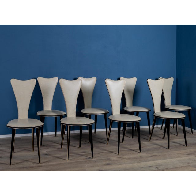An elegant set of eight chairs designed by Umberto Mascagni, a refined expression of mid-twentieth-century Italian design....