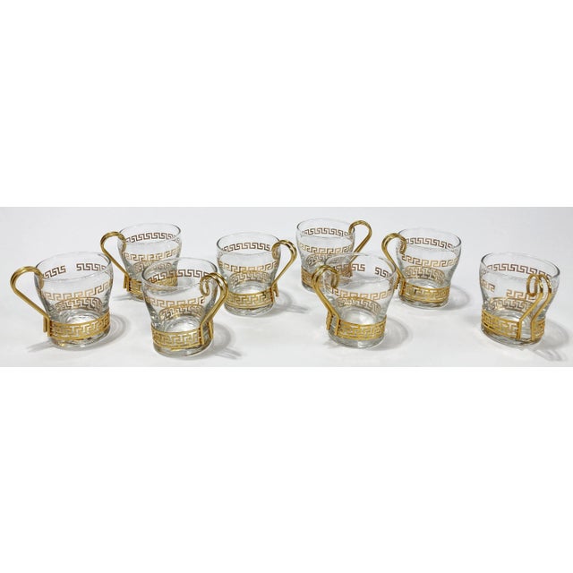 Beautiful set of eight (8) vintage brass metal patterned to Greek Key handled coffee glasses. Age wear. Patina. No chips...