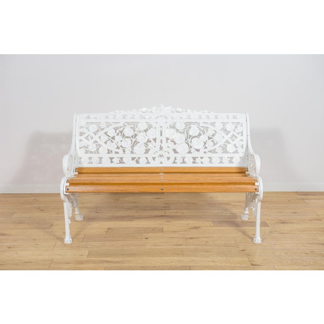 This English garden bench was manufactured in the United Kingdom during the 1950s. The model was created in a classic...