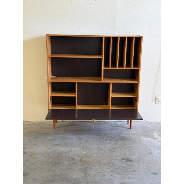 Authentic Mid Century Danish Modern secretary bookcase by Domino Møbler, made in Denmark. Crafted in beautiful oak, this...