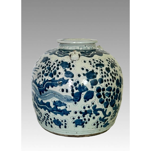 Antique Chinese Wine Vessel having Phoenix motif on either side, small loop or lug handles and pouring spout. Originally...