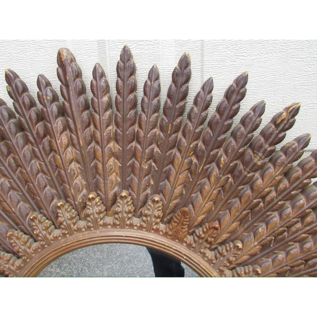 Vintage sunburst mirror, c.1970’s A large sunburst mirror made from a molded composite material. Having a smaller frame...