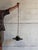 This elegant pendant lamp features a rich green glass shade paired with polished brass hardware and a hanging chain. The...