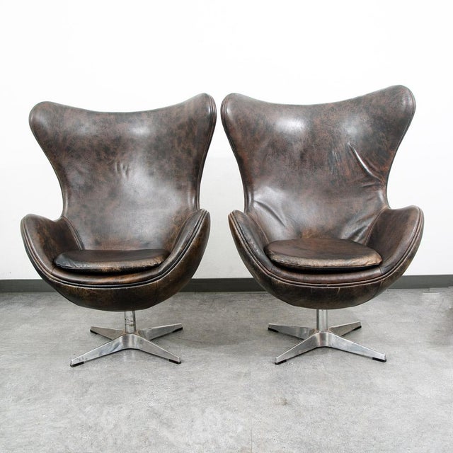 A lounge chair set to drool over! Restoration hardware egg chairs in distressed leather. Extremely comfortable and very...