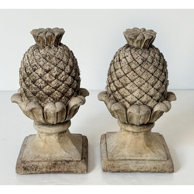 A pair of fine Italian garden ornamental statuary finials or copings of composition stone - each lightly weathered and in...