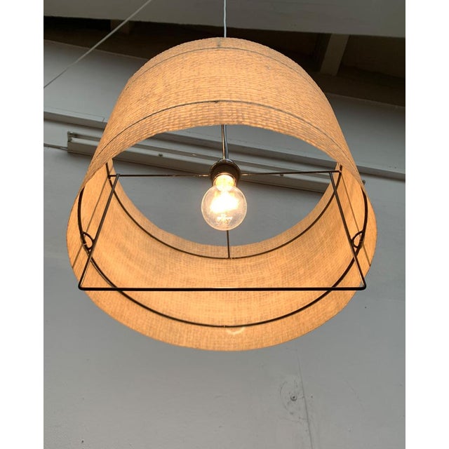 Filigree Mid Century pendant lamp. A minimalist design. A finely executed frame of metal rods covered with a thin plastic...