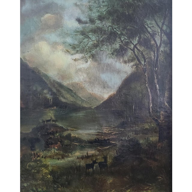 Late 19th to early 20th century oil painting depicting a woodland landscape with a lake and several deer. Teeming with...